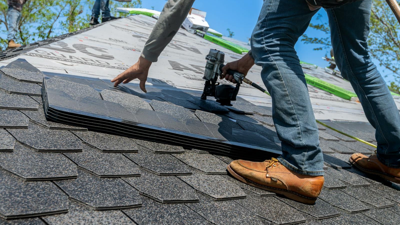 Professional roofers at work on roof